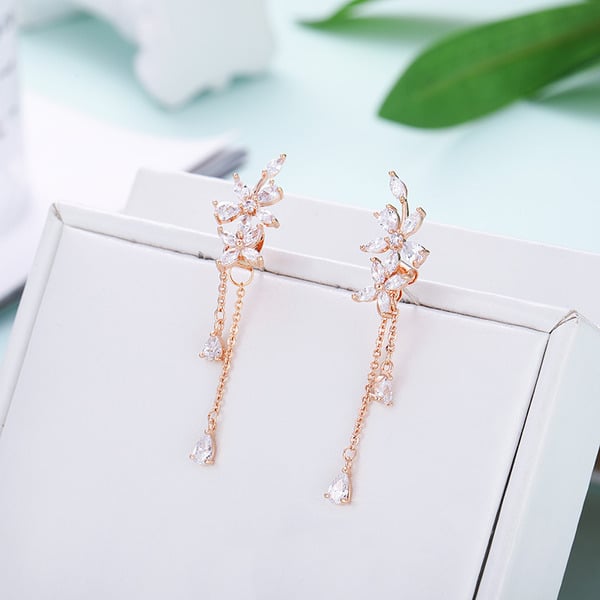 Charmantes boucles d'oreilles pendantes avec strass/glands