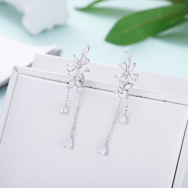 Charmantes boucles d'oreilles pendantes avec strass/glands